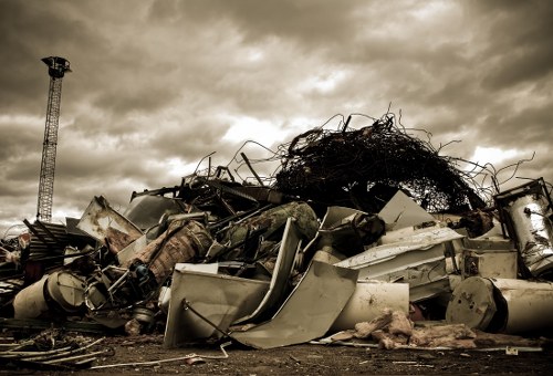 Homeowner preparing garden for clearance in Addlestone